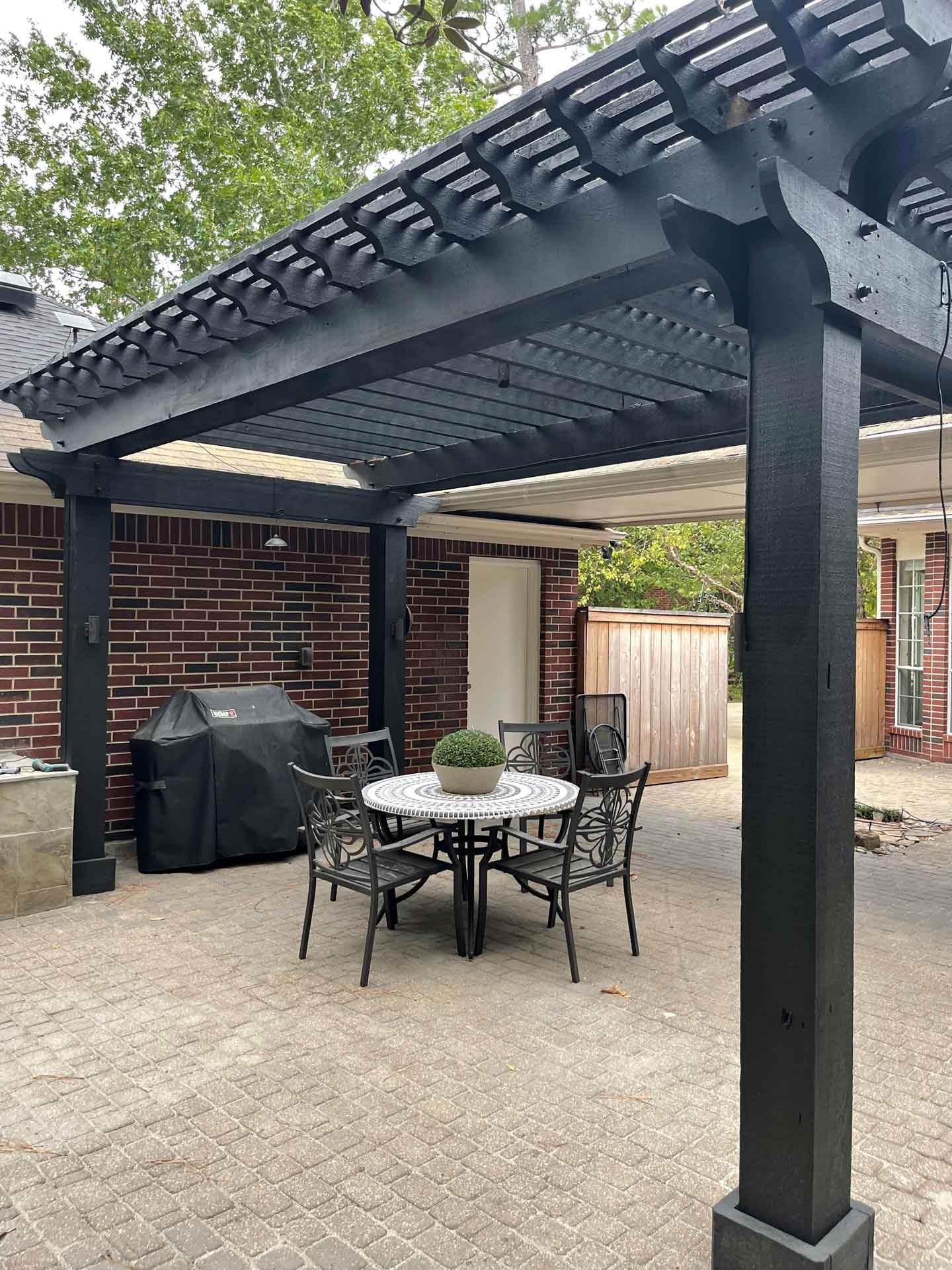 Custom wooden pergola and patio with pavers
