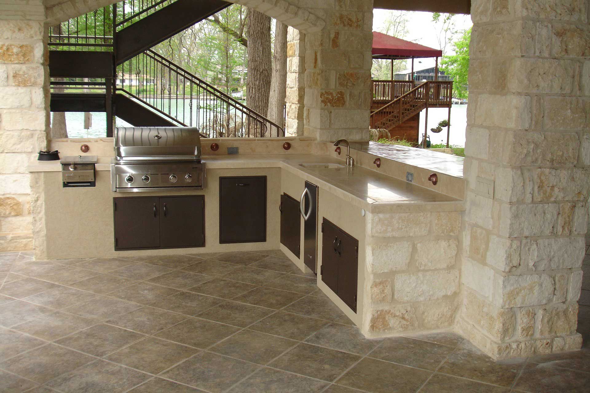 Custom outdoor kitchen in a covered pavers patio