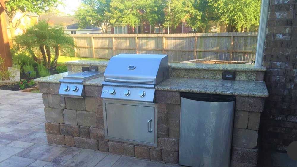 stone-covered outdoor kitchen