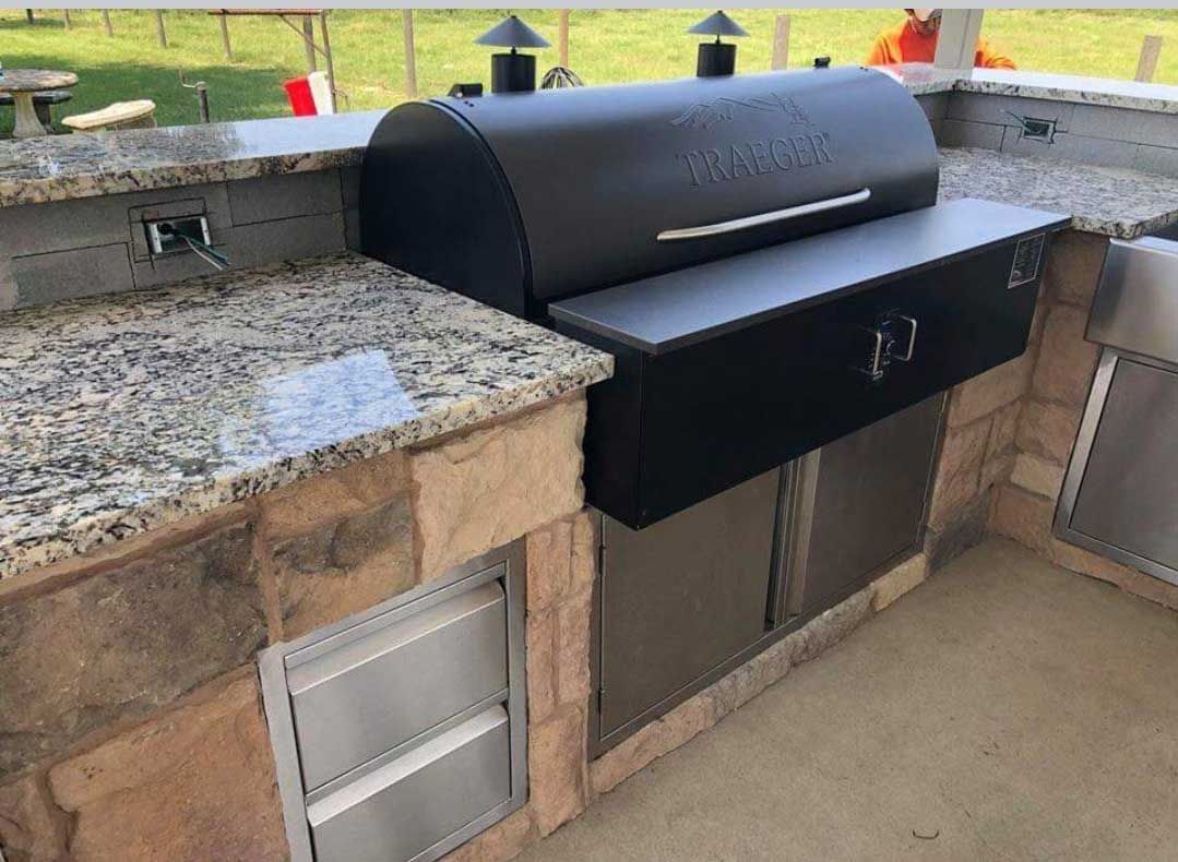 Custom Outdoor Kitchen with granite countertop and stones