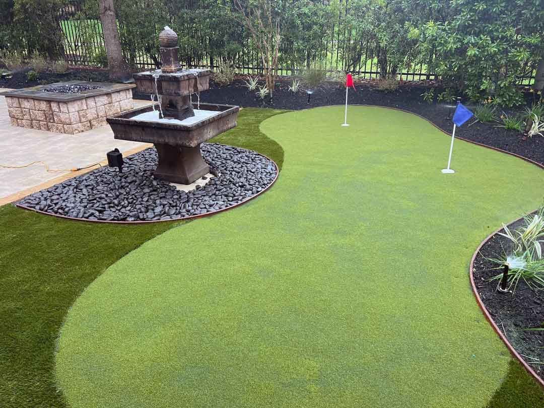 outdoor putting green with landscape and outdoor lighting