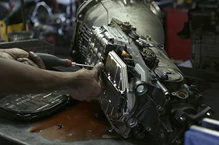 tech working on transmission rebuild