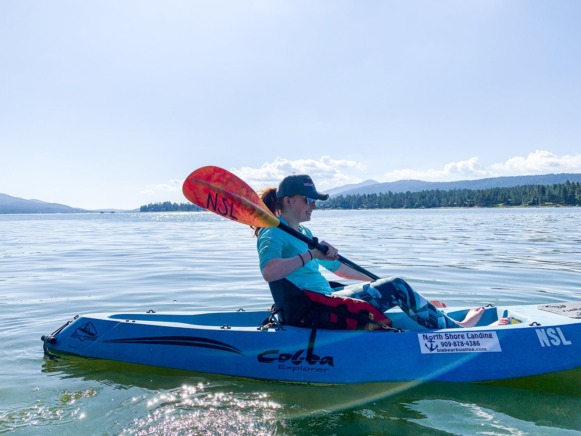 woman in blue kayak