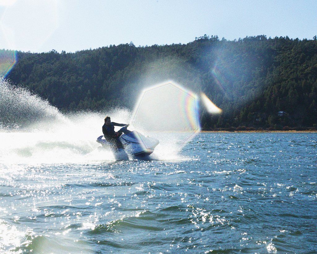 man riding black jet ski in big bear lake