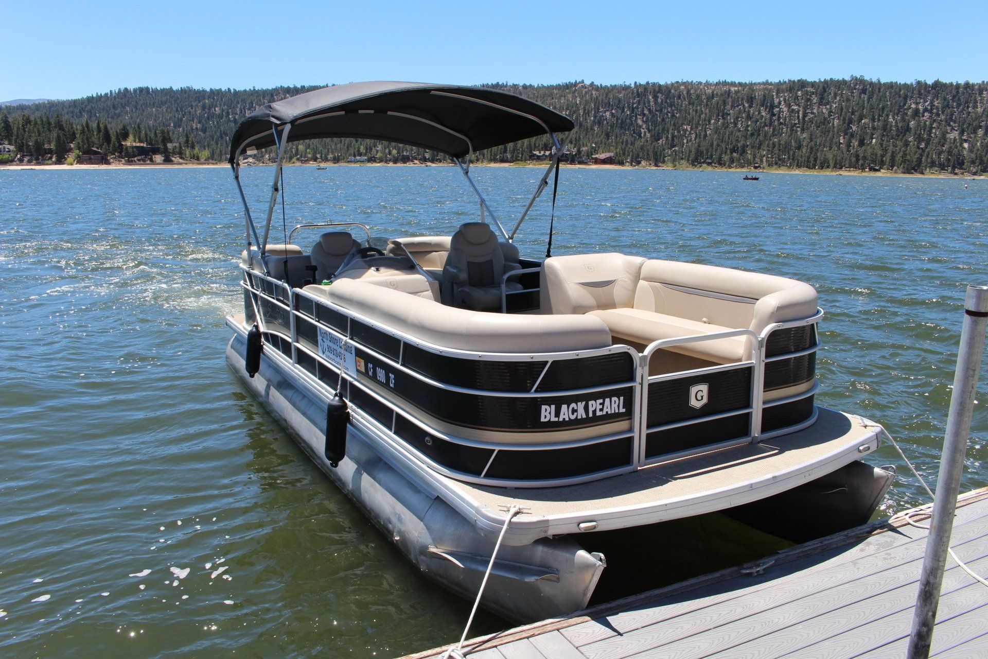 Tan and black pontoon boat rental in Big Bear Lake CA