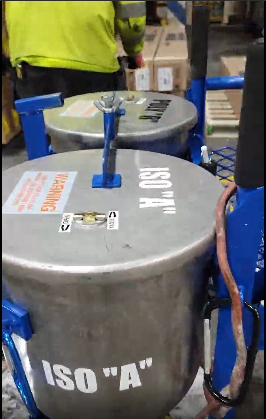 Two stainless steel tanks labeled