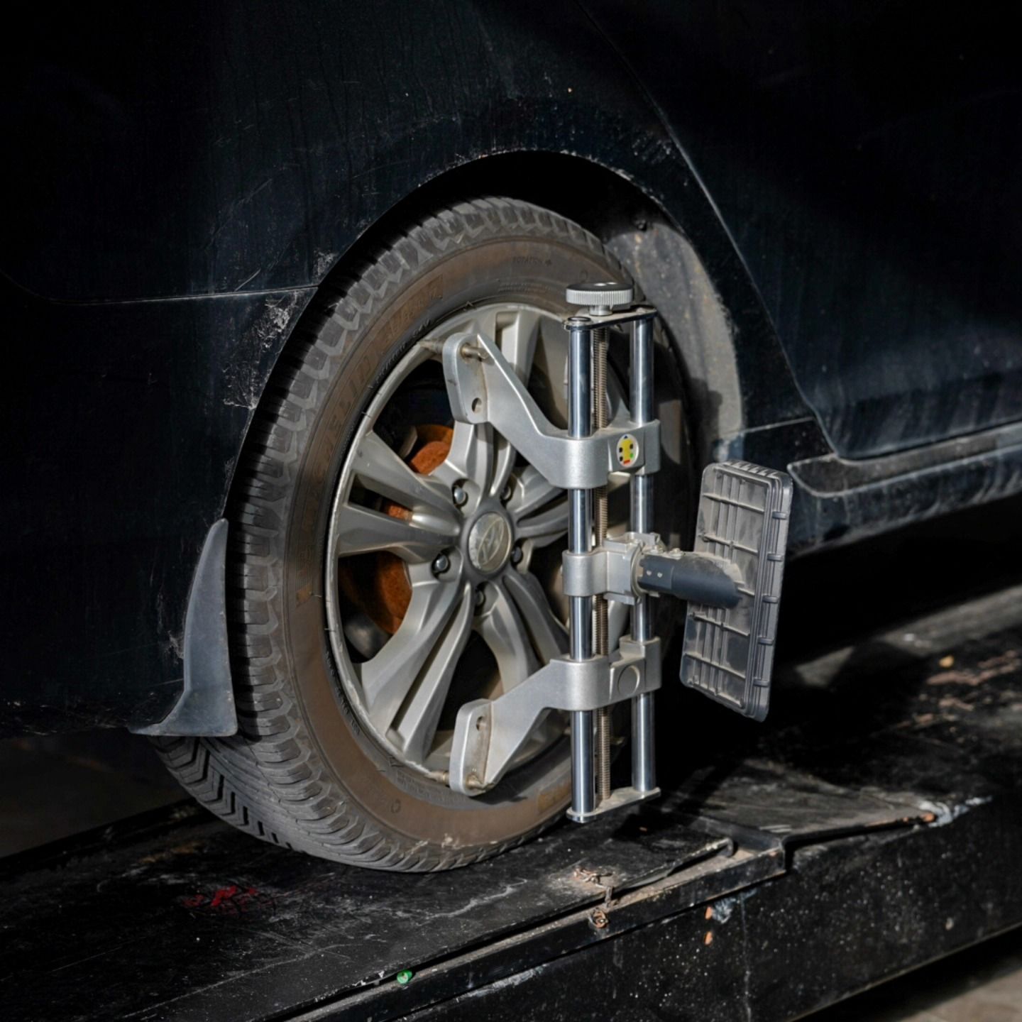 Close-Up Of Wheel Alignment Equipment On Vehicle Tire | Lenexa, KS