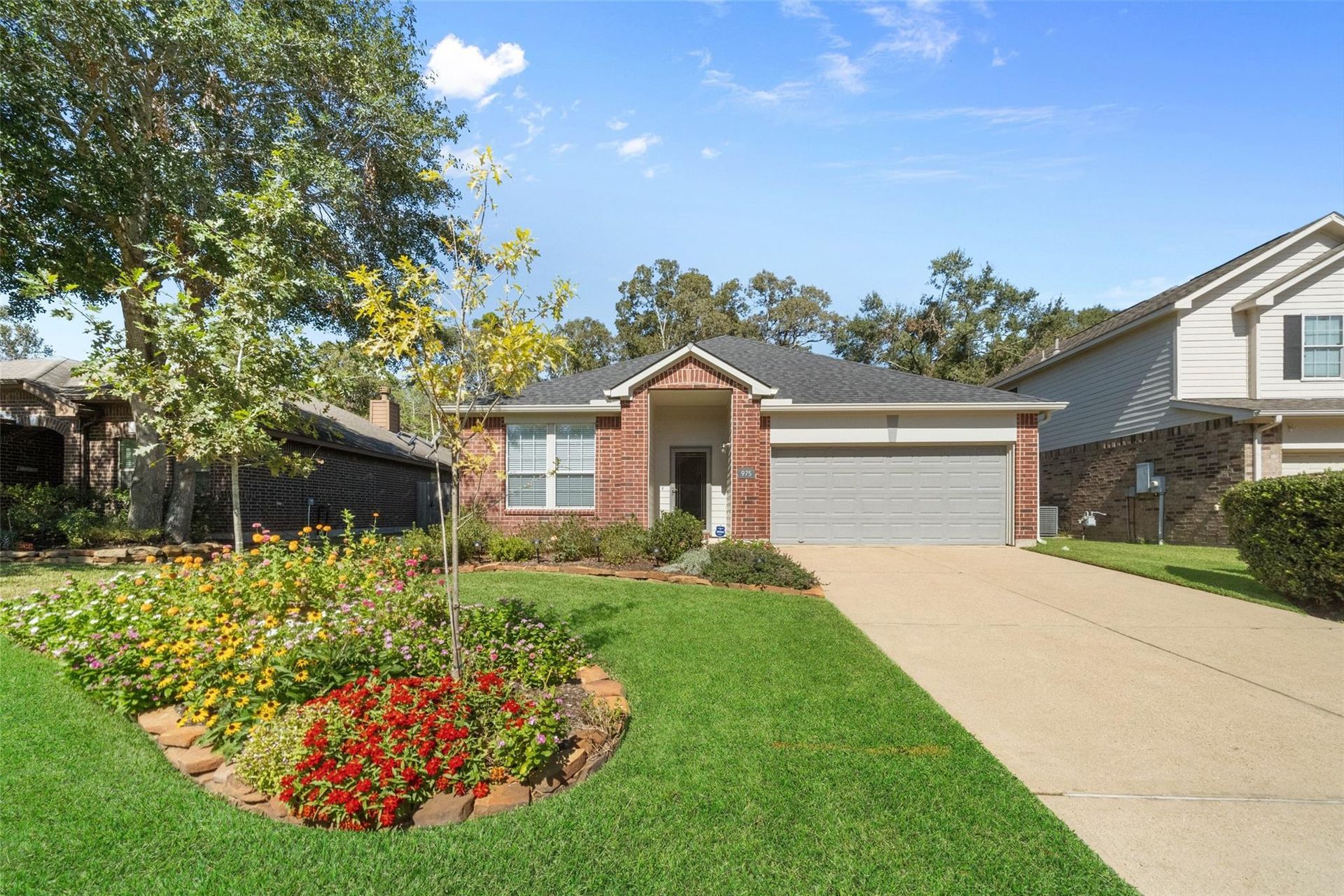 A vase of flowers is sitting on a table next to a window.