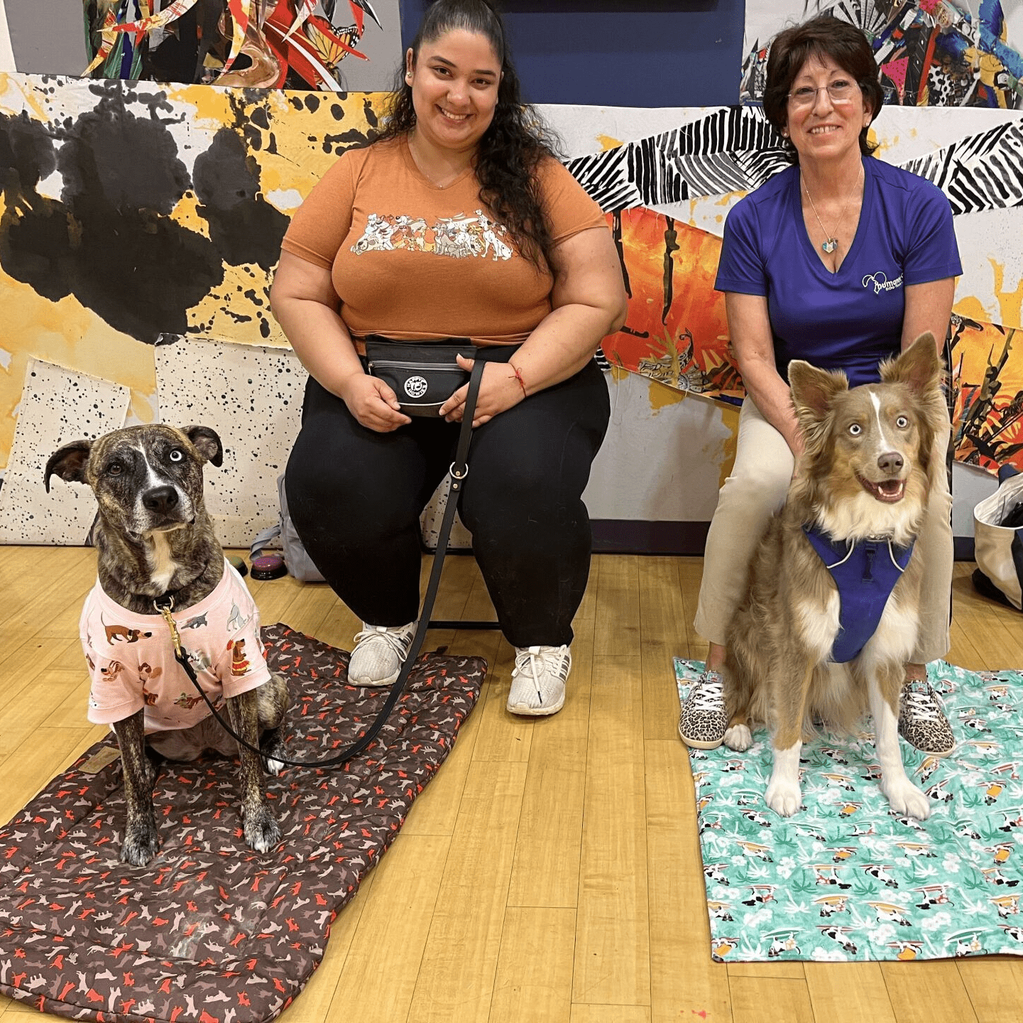 two women with their dogs