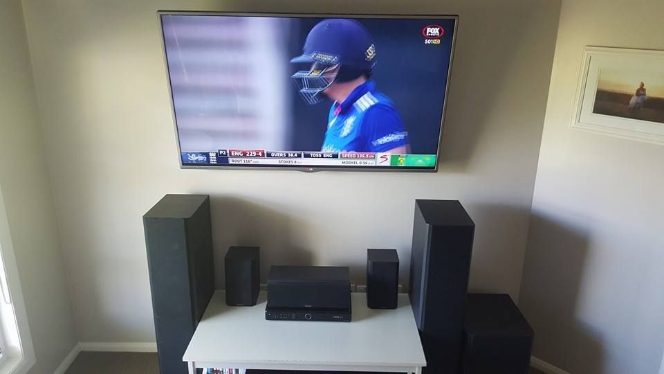 Room With Flat Screen TV On Wall And Speakers — Stand Fast Electrical Pty Ltd in Warwick, QLD