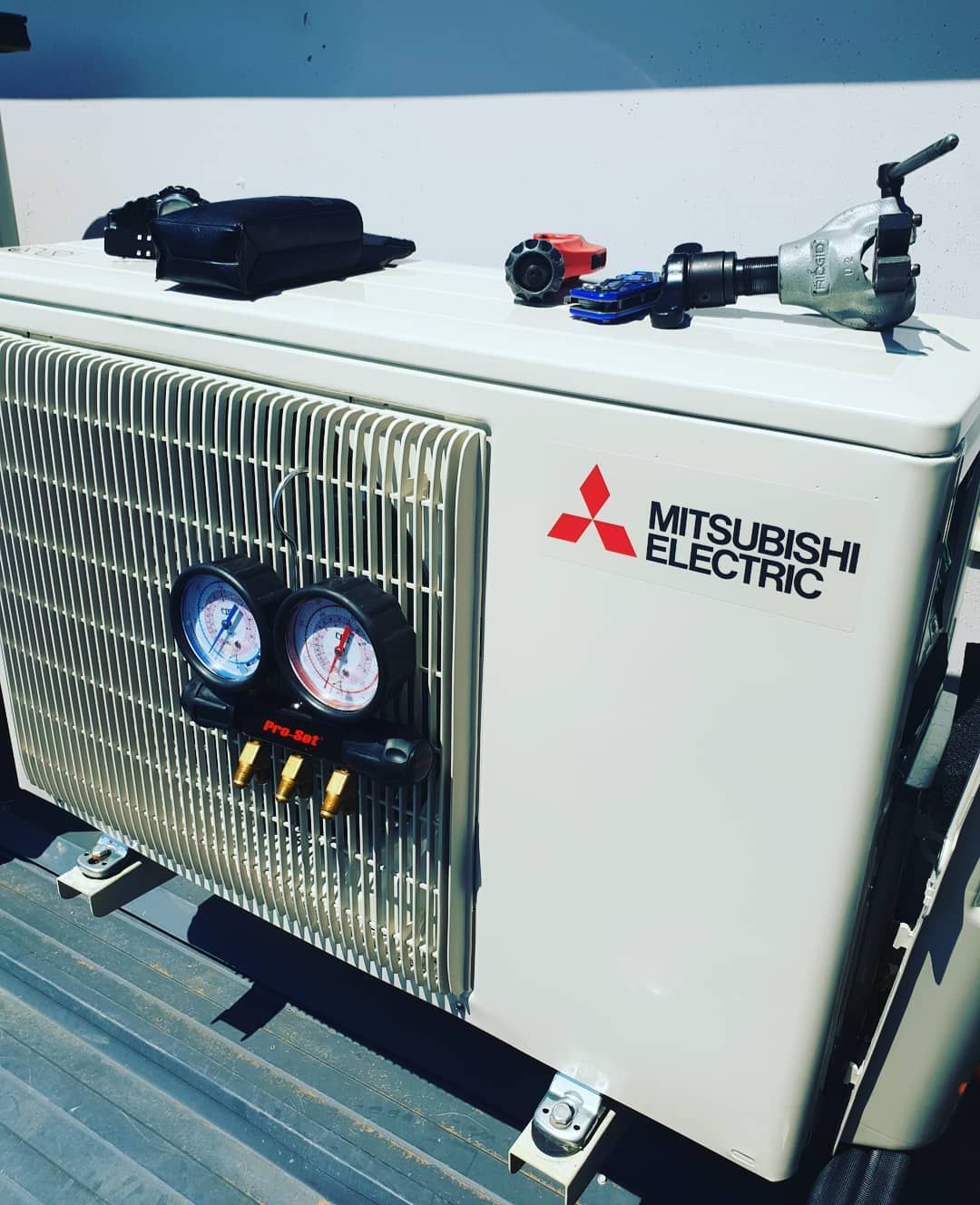 Mitsubishi Electric Air Conditioner Is Sitting On A Roof — Stand Fast Electrical Pty Ltd in Inglewood, QLD