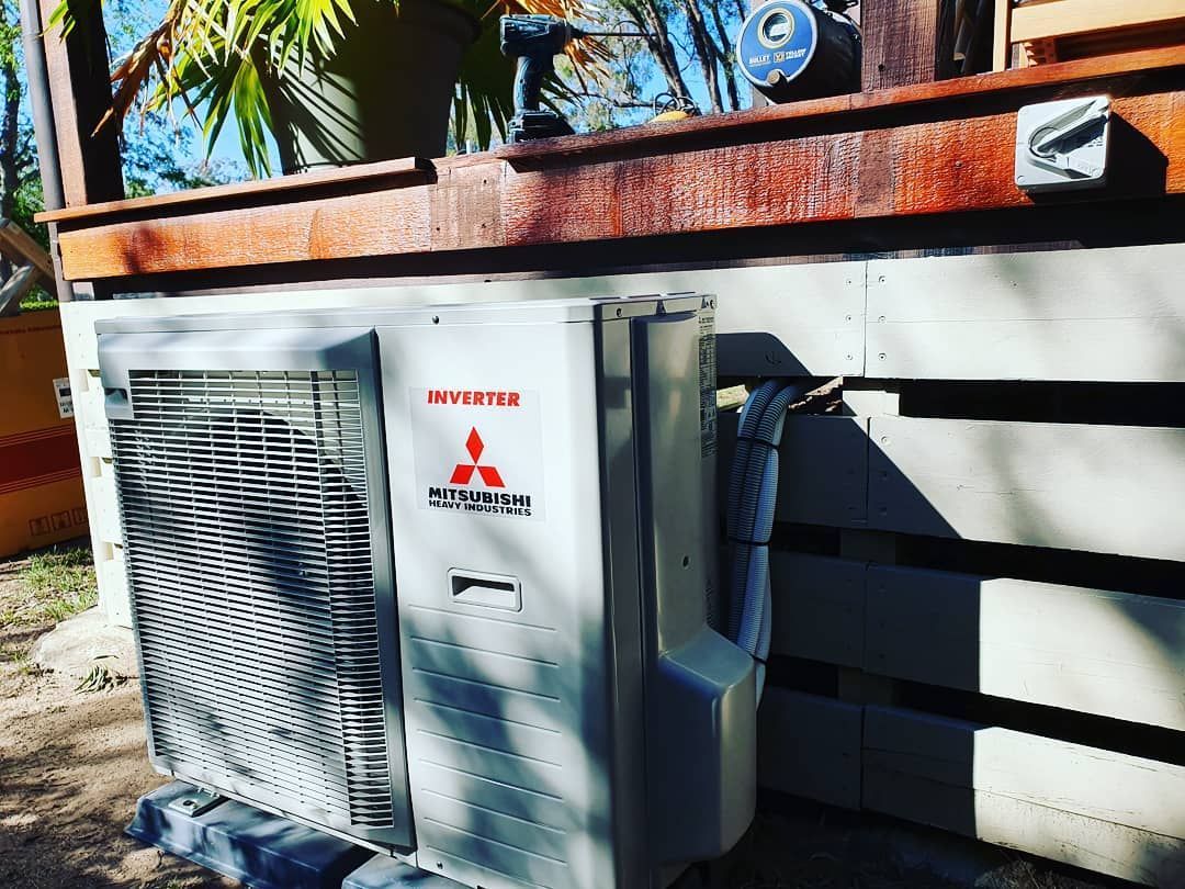 An Aerial View of A Bridge Over a River in The Middle of A Valley — Stand Fast Electrical Pty Ltd in Killarney, QLD