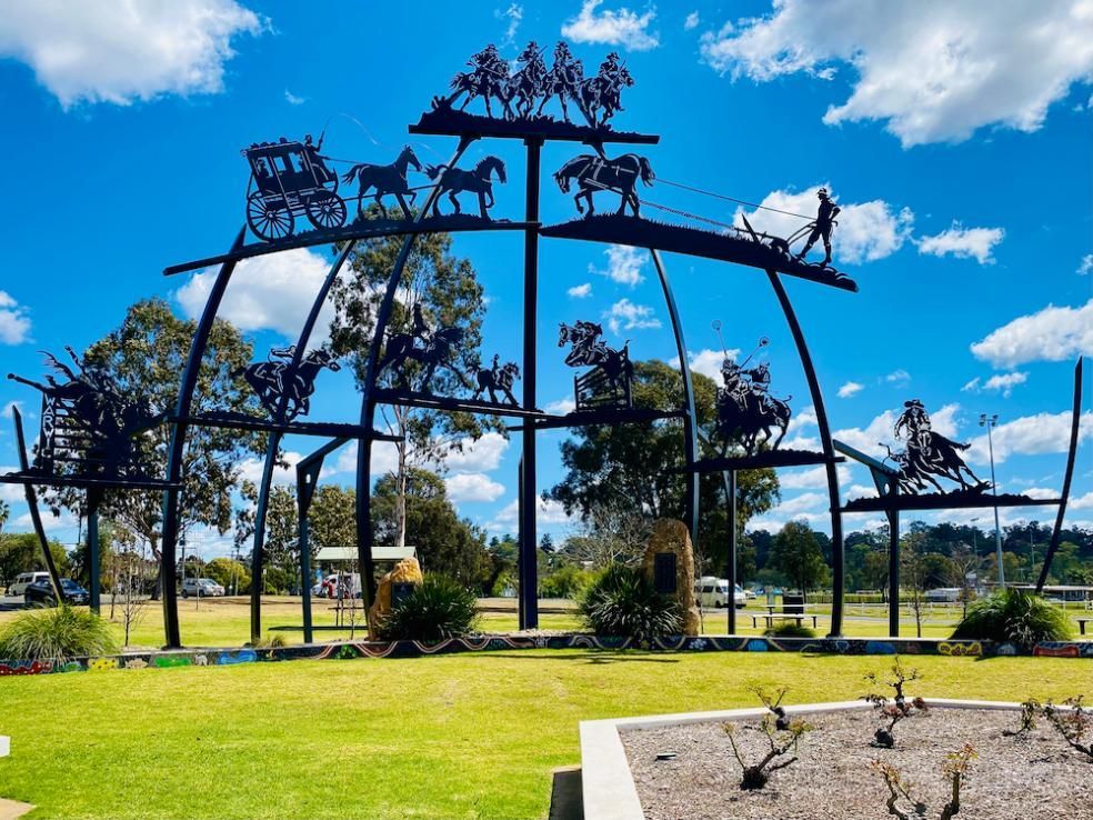 A Large Sculpture Of Horses Pulling A Carriage In A Park — Stand Fast Electrical Pty Ltd in Warwick, QLD