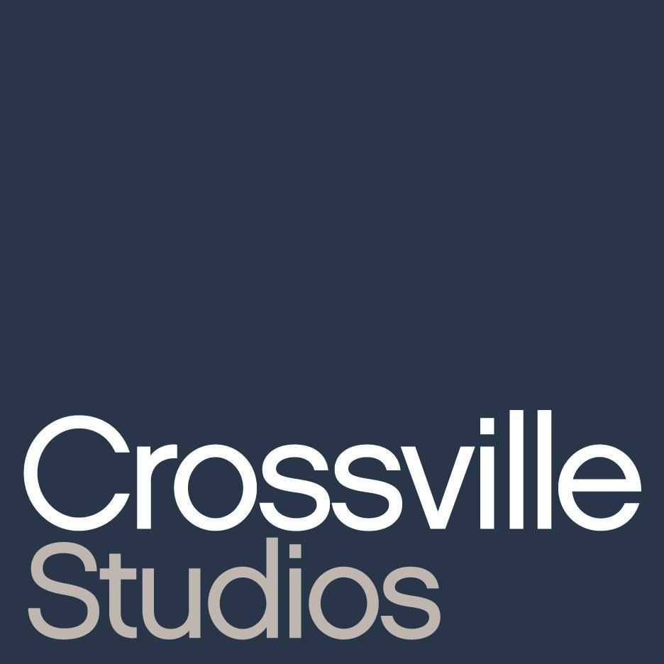 A logo for crossville studios on a blue background