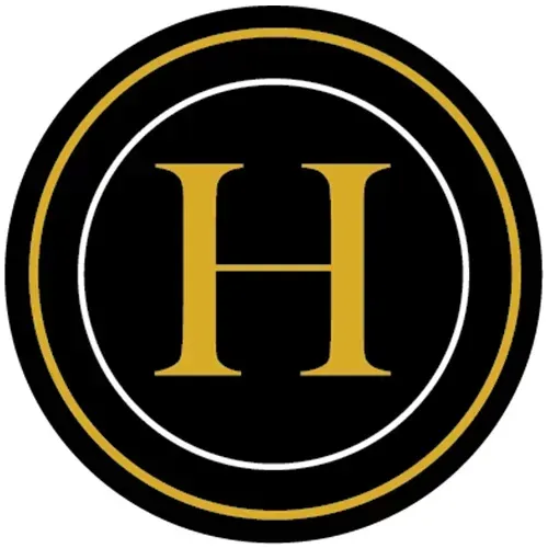 A black and gold logo with the letter h in a circle.