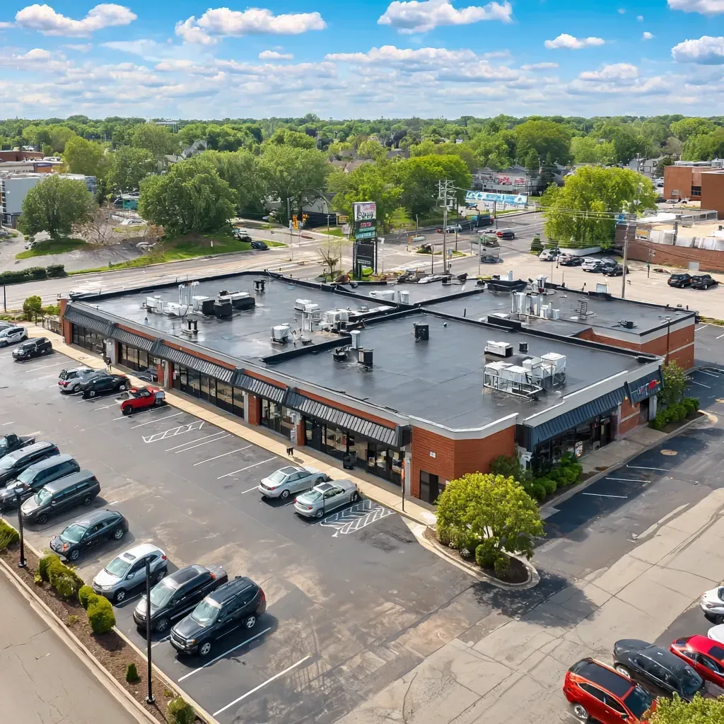 Low-slope roof sealing Evanston IL for commercial buildings using fluid-applied membrane restoration systems, cap sheet rejuvenation, and silicone top layers with high elongation.