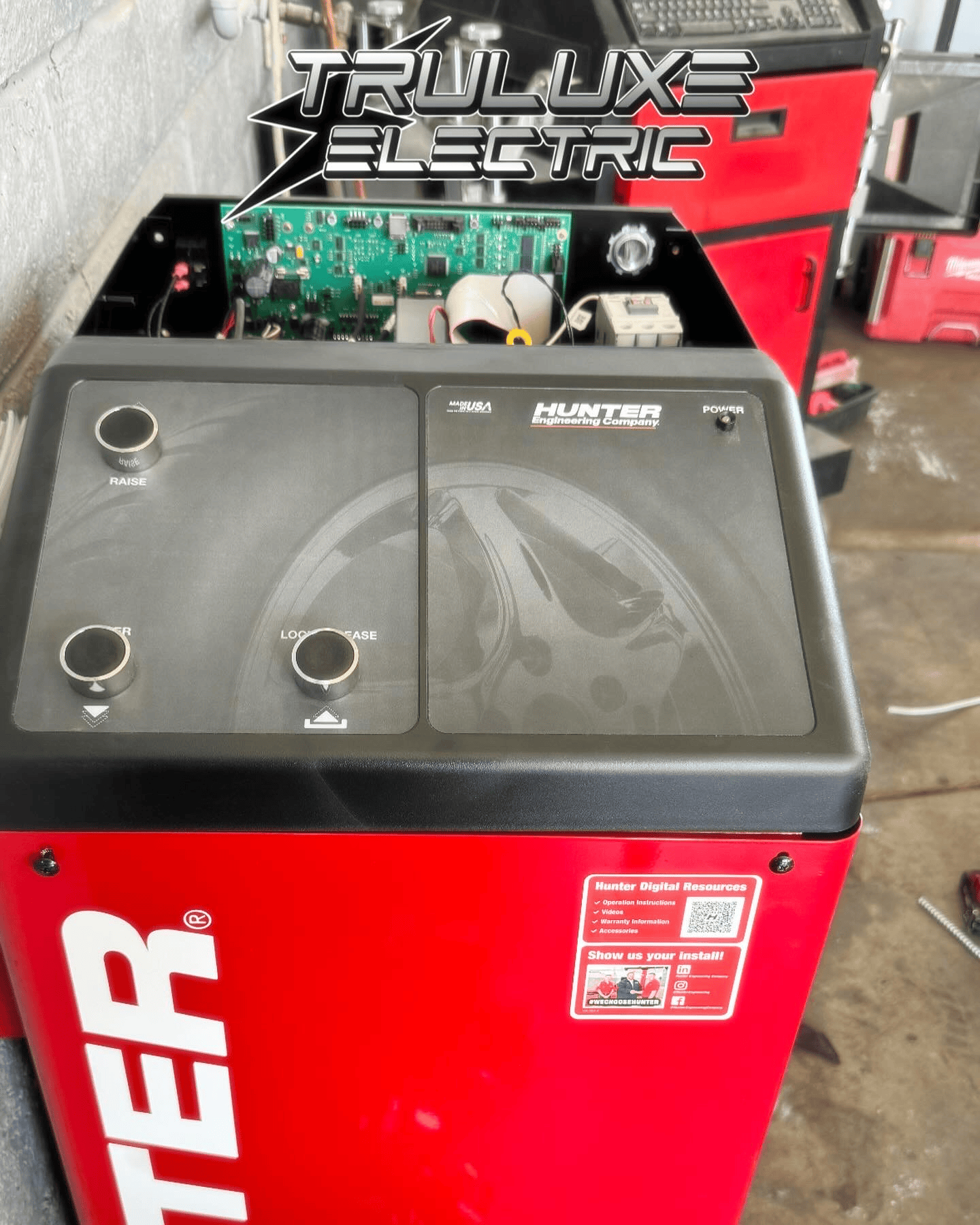 A truluxe electric machine is sitting in a garage