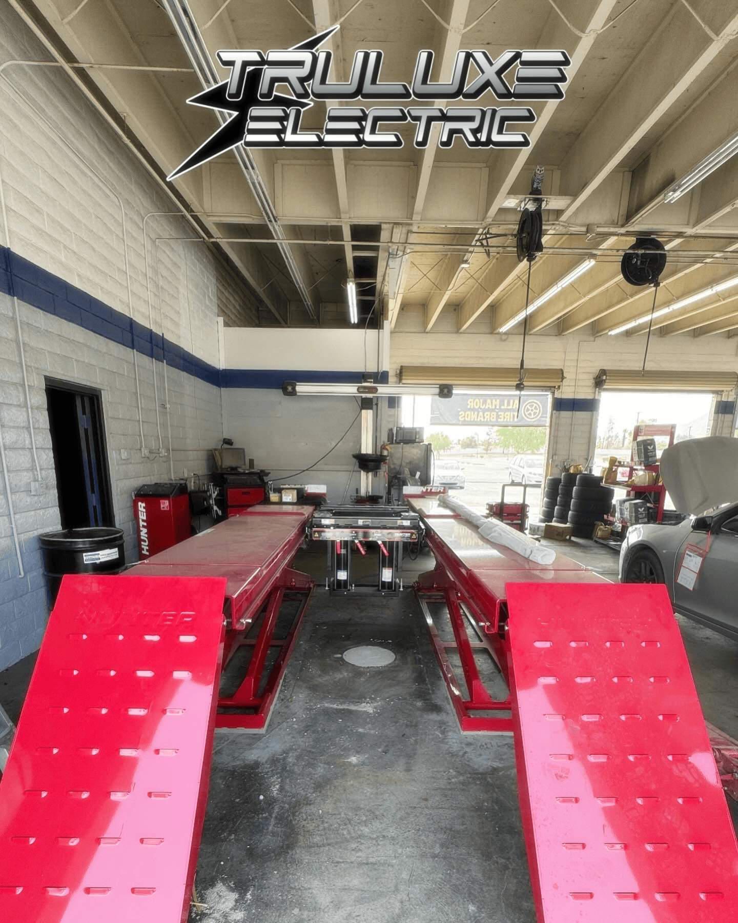 A picture of a garage with a sign that says truluxe electric