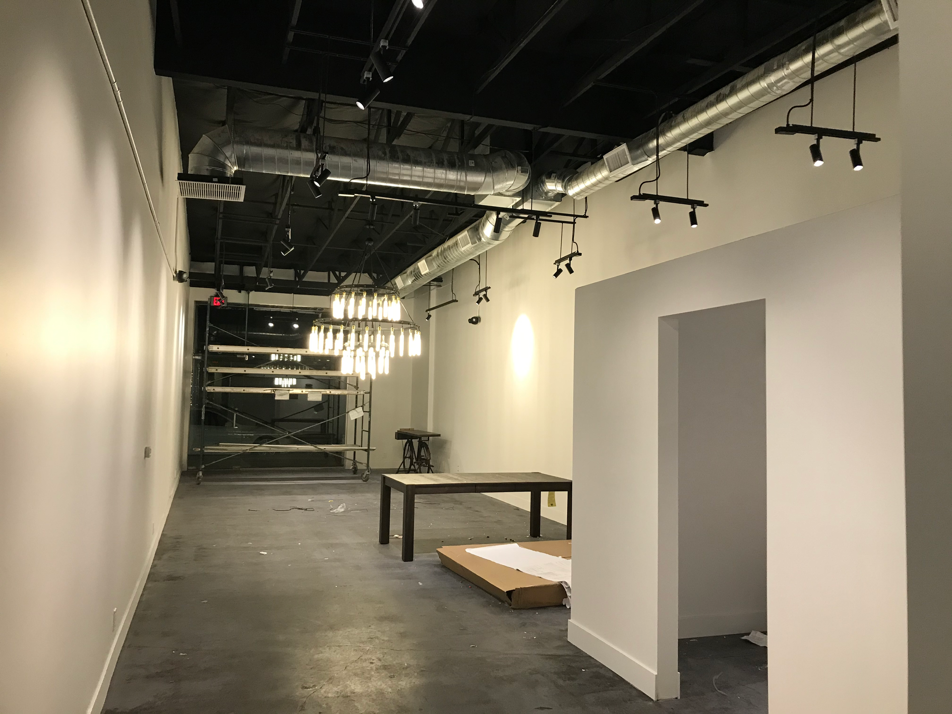 There is a table in the middle of the room.