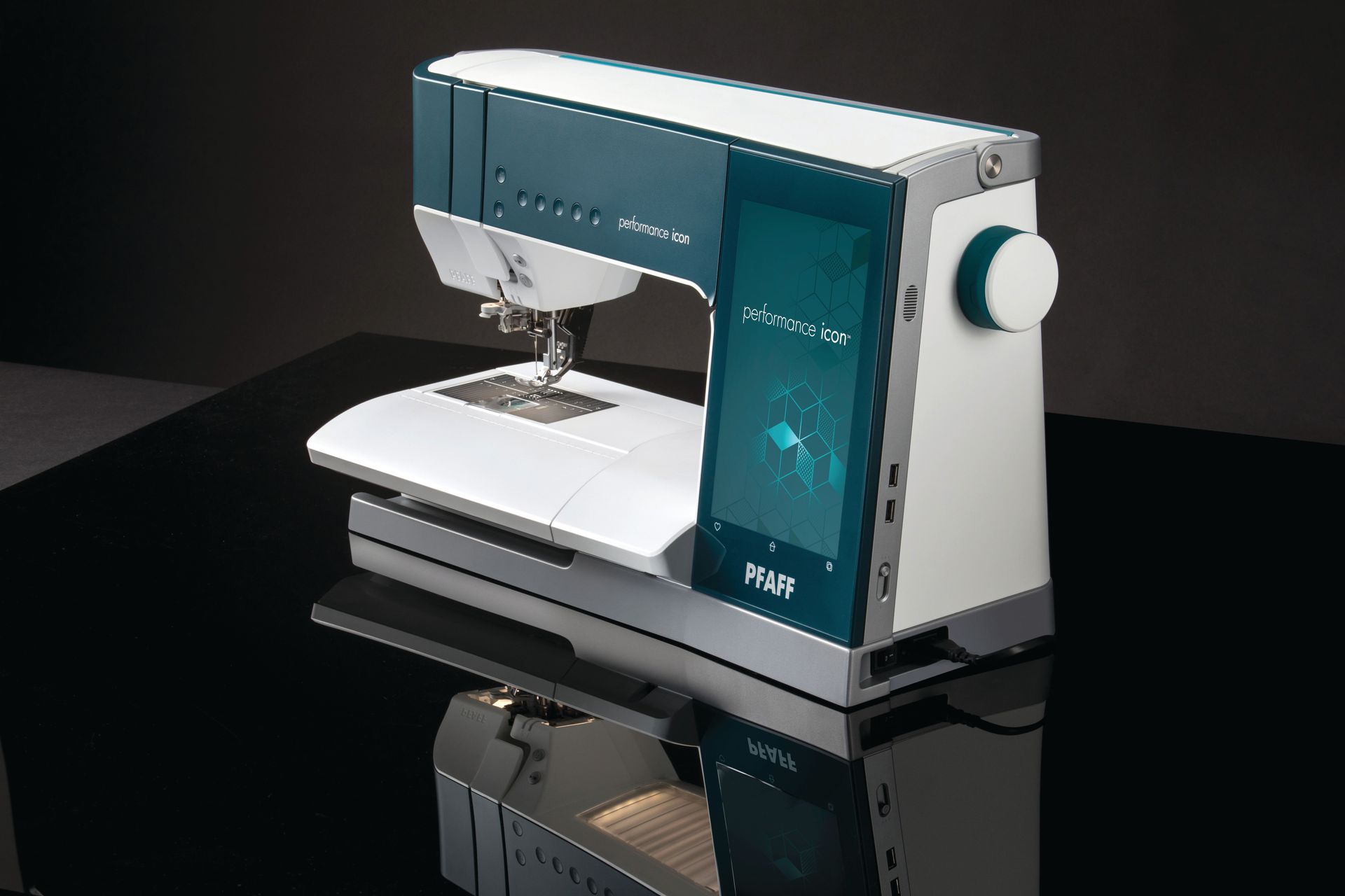 A white and blue sewing machine is sitting on a black table.