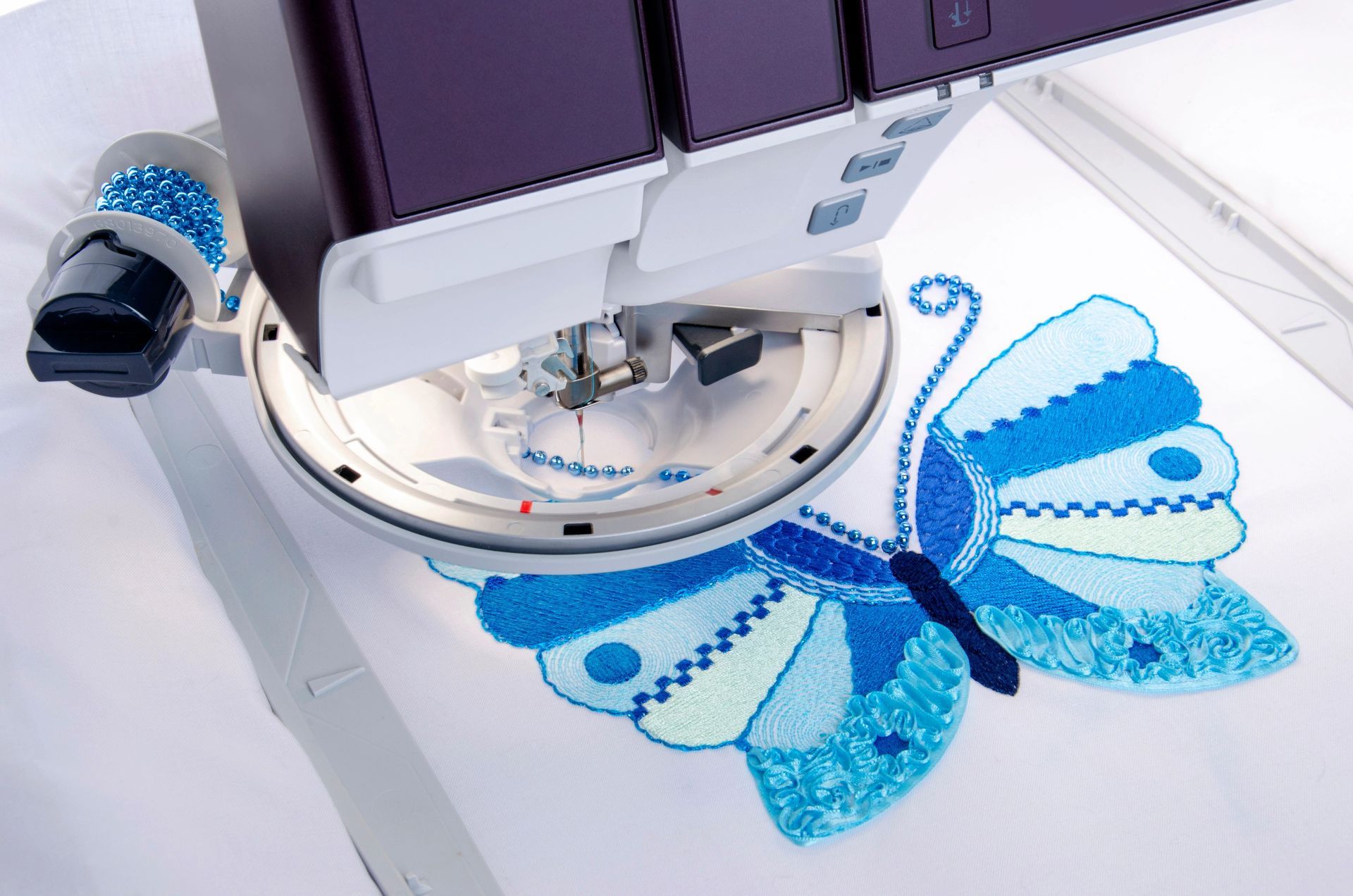 A sewing machine with a blue butterfly on it