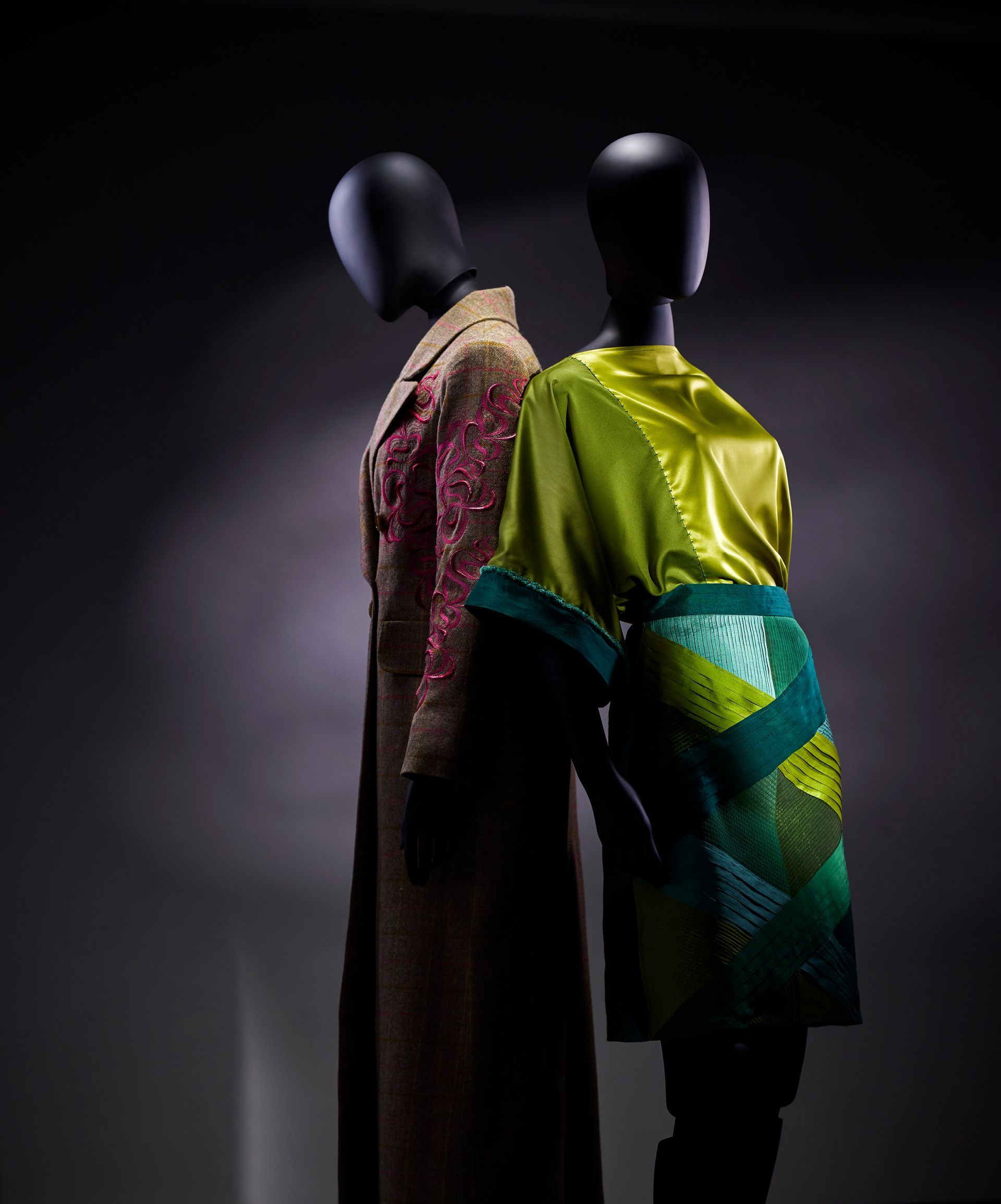 A woman is carrying a sewing machine on a purple background.