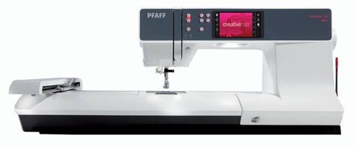 A pfaff sewing machine is sitting on a white surface.