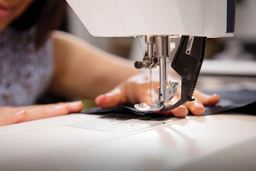 Woman Using a Sewing Machine