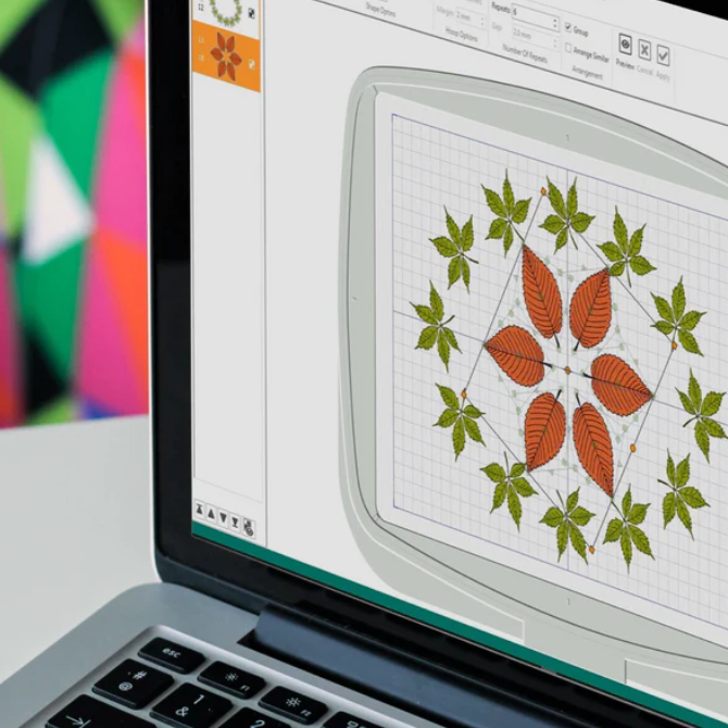 A laptop with a picture of leaves on the screen