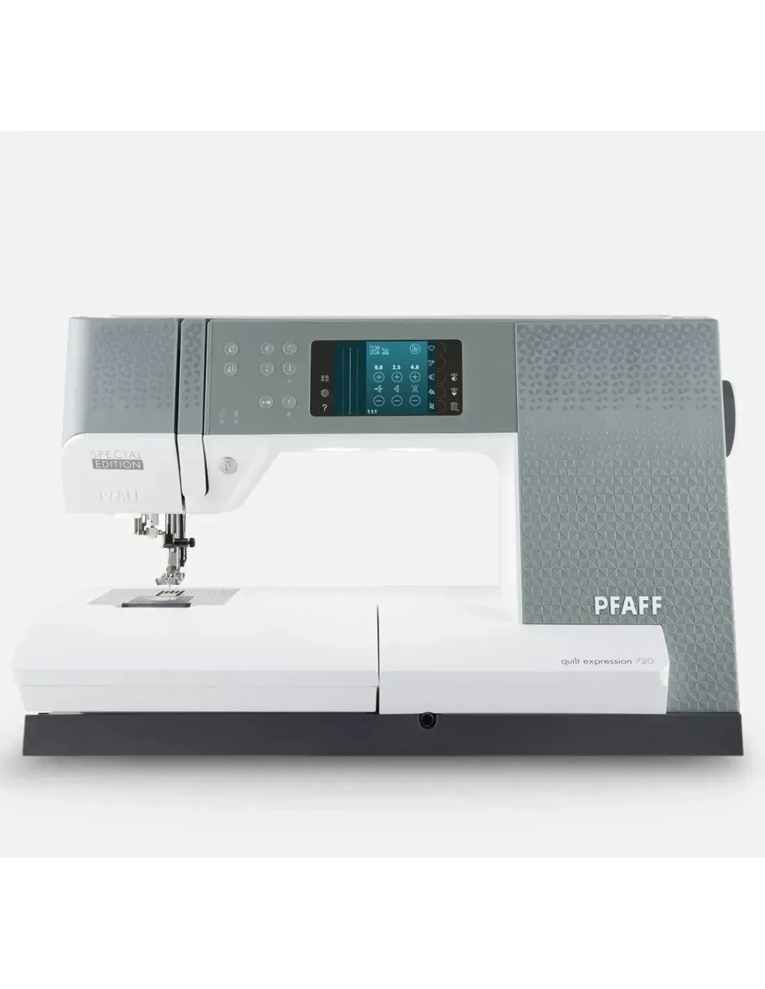 A pfaff sewing machine is sitting on a white table.