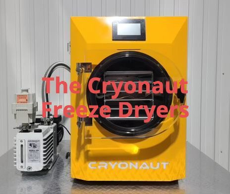 A yellow cryonaut freeze dryer is sitting on a table.