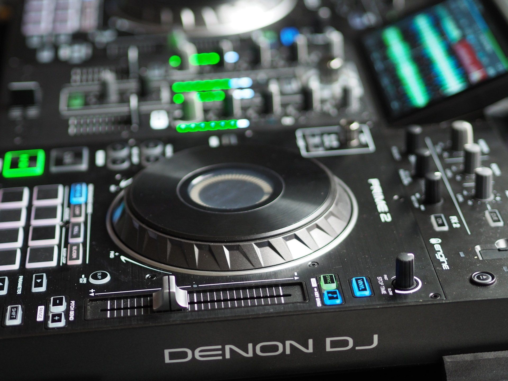 A denon dj controller is sitting on a table