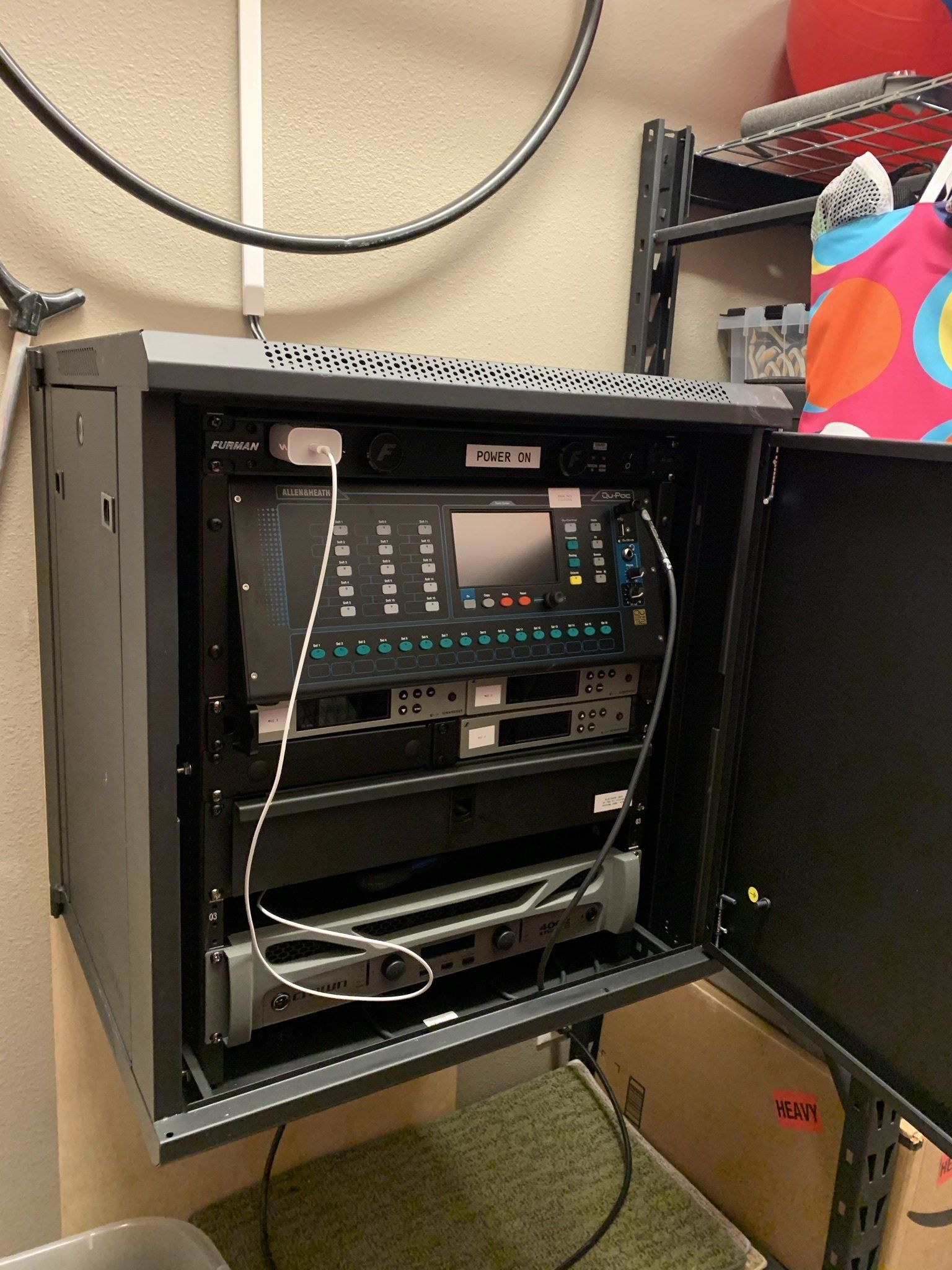 A black cabinet with a computer inside of it.