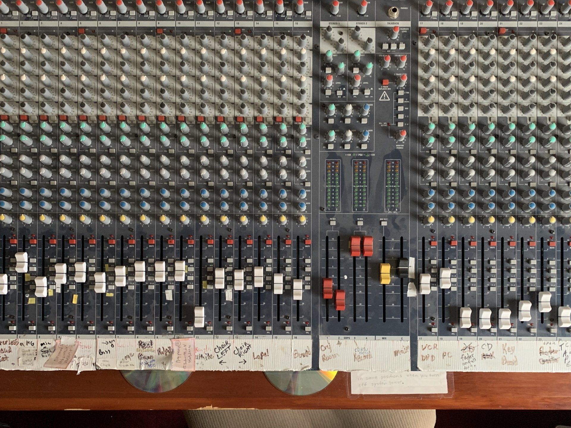 A mixer with a lot of knobs and buttons on it