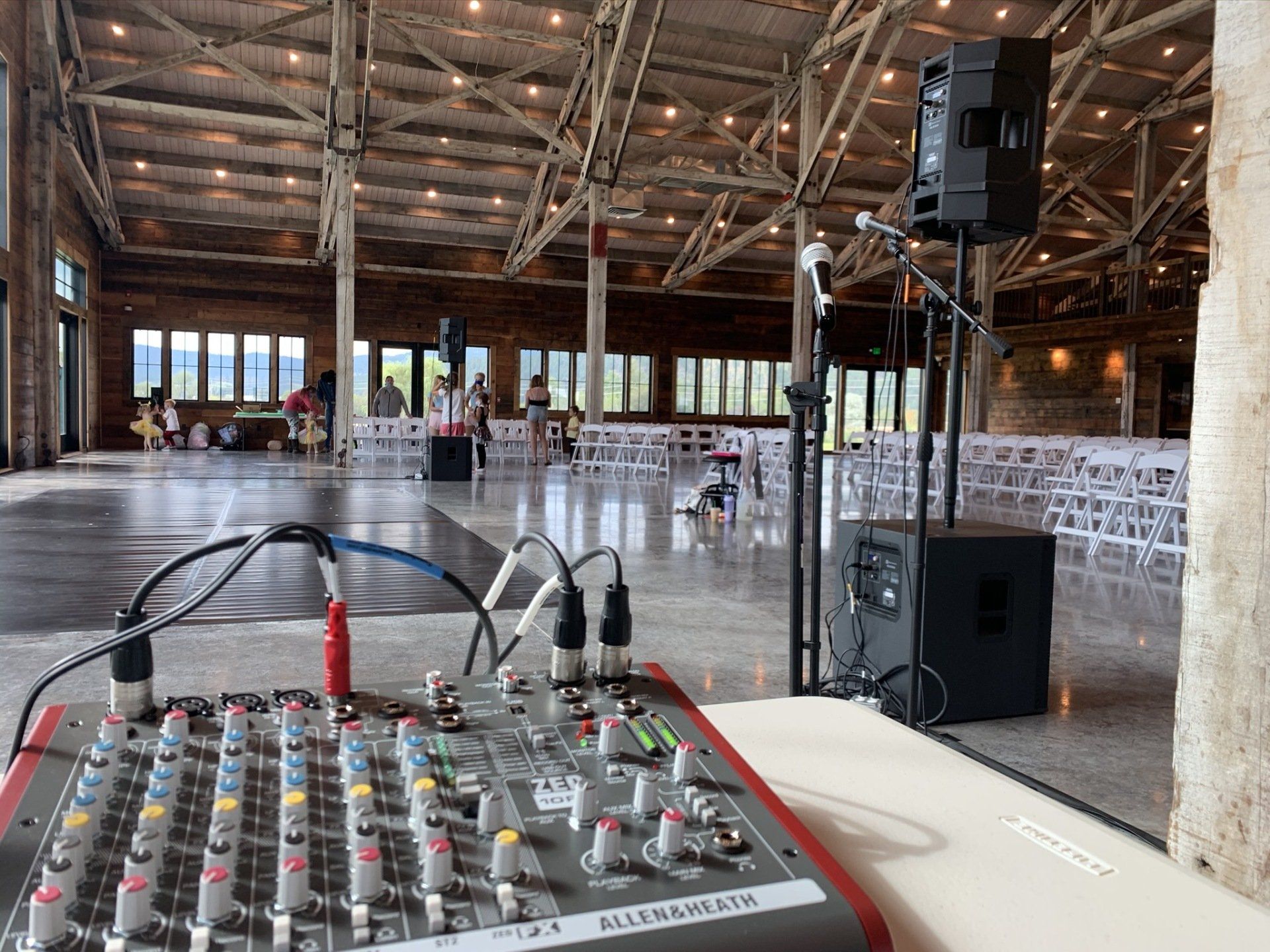 A mixer is sitting in the middle of a large room.