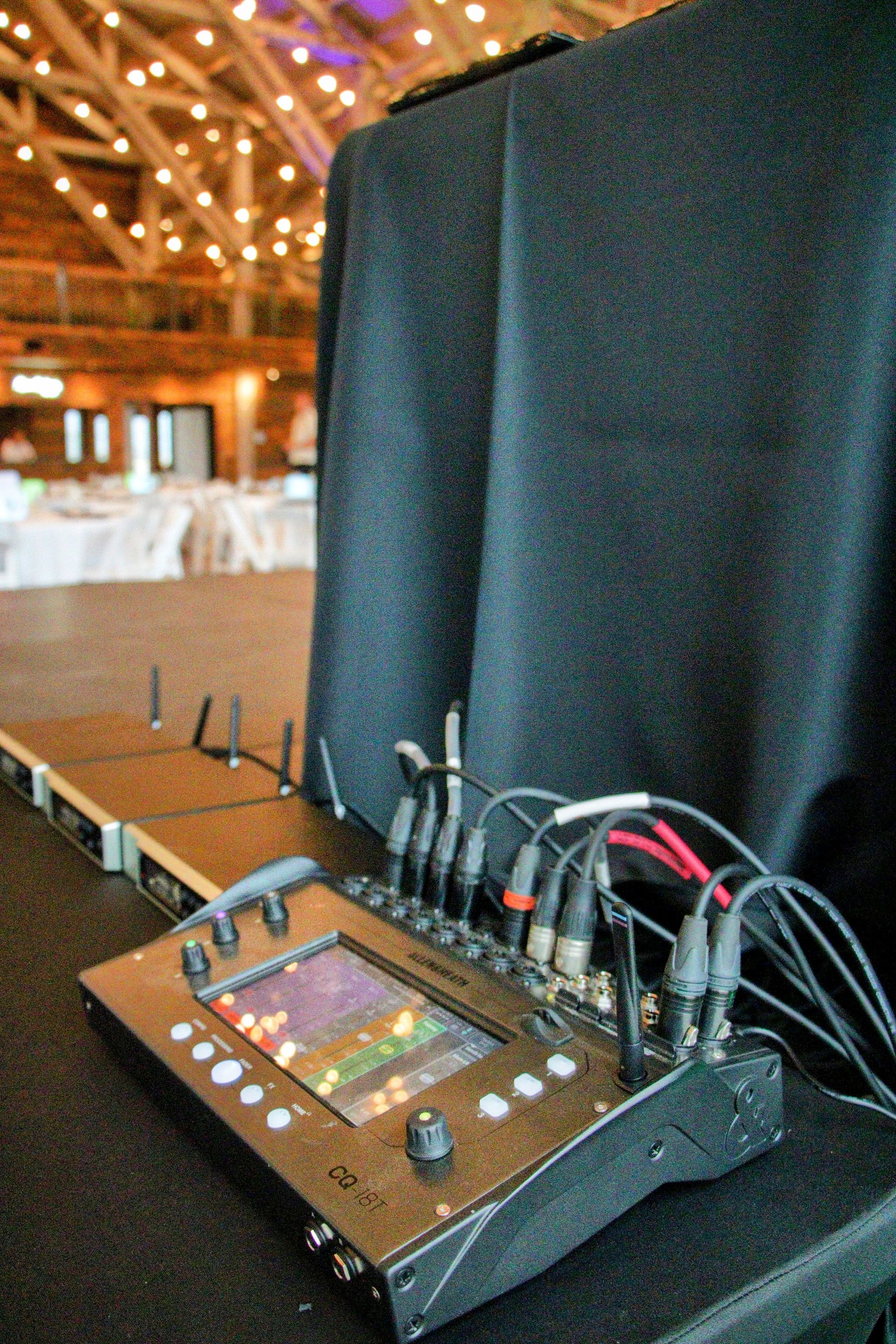 A mixer with a screen is sitting on a table.