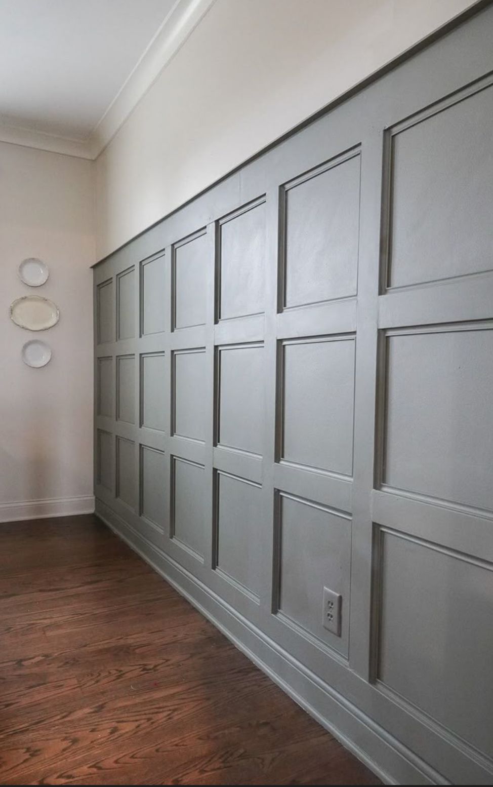 AD Construction NJ - Gray paneled wall with a decorative pattern, contrasting with the light-colored upper wall.