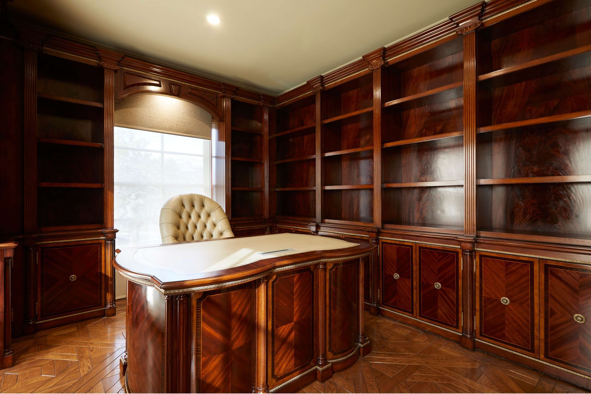 AD Construction NJ - Elegant wood-paneled office with a desk, chair, and built-in bookshelves.