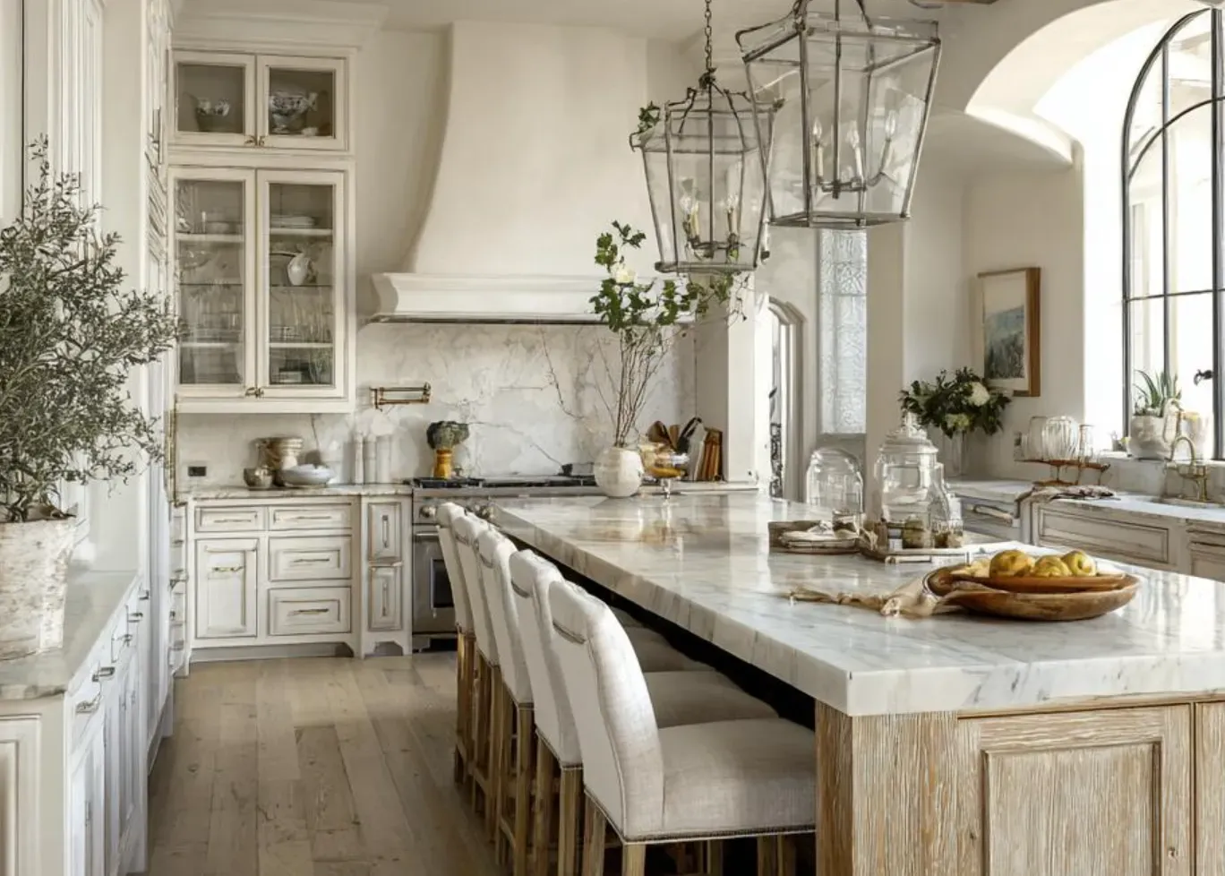 AD Construction NJ - Elegant white kitchen with marble countertops, wooden island, and large arched window.