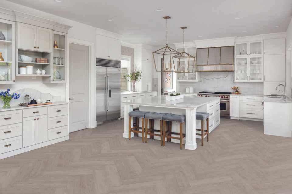 AD Construction NJ - Elegant white kitchen with marble countertops, stainless steel appliances, and patterned flooring.