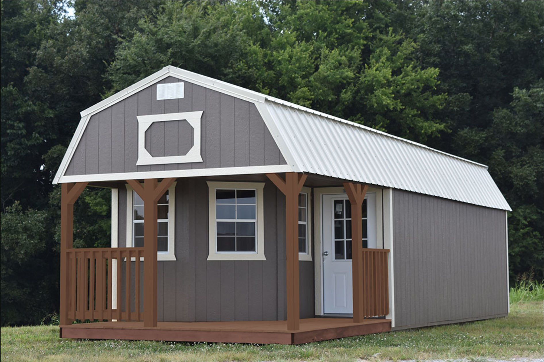 A small house with a porch and a roof that looks like a barn.