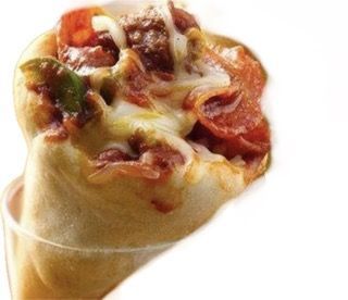 Pile of golden-brown chicken wings, coated in parmesan and herbs, in a basket.