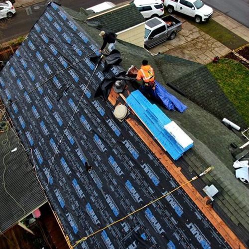 An aerial view of a roof that is being installed