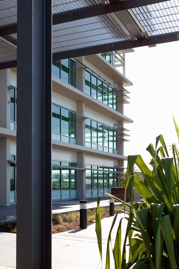 A Large Building With A Lot Of Windows And A Few Plants In Front Of It — Datco Aluminium Pty Ltd In Murwillumbah, NSW