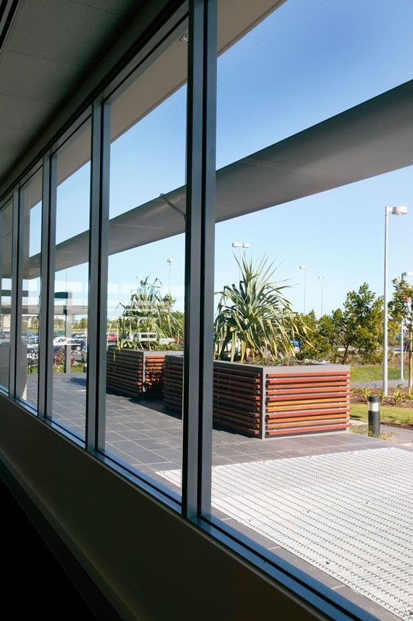 A Building With A Lot Of Windows Looking Out To A Parking Lot — Datco Aluminium Pty Ltd In Casino, NSW