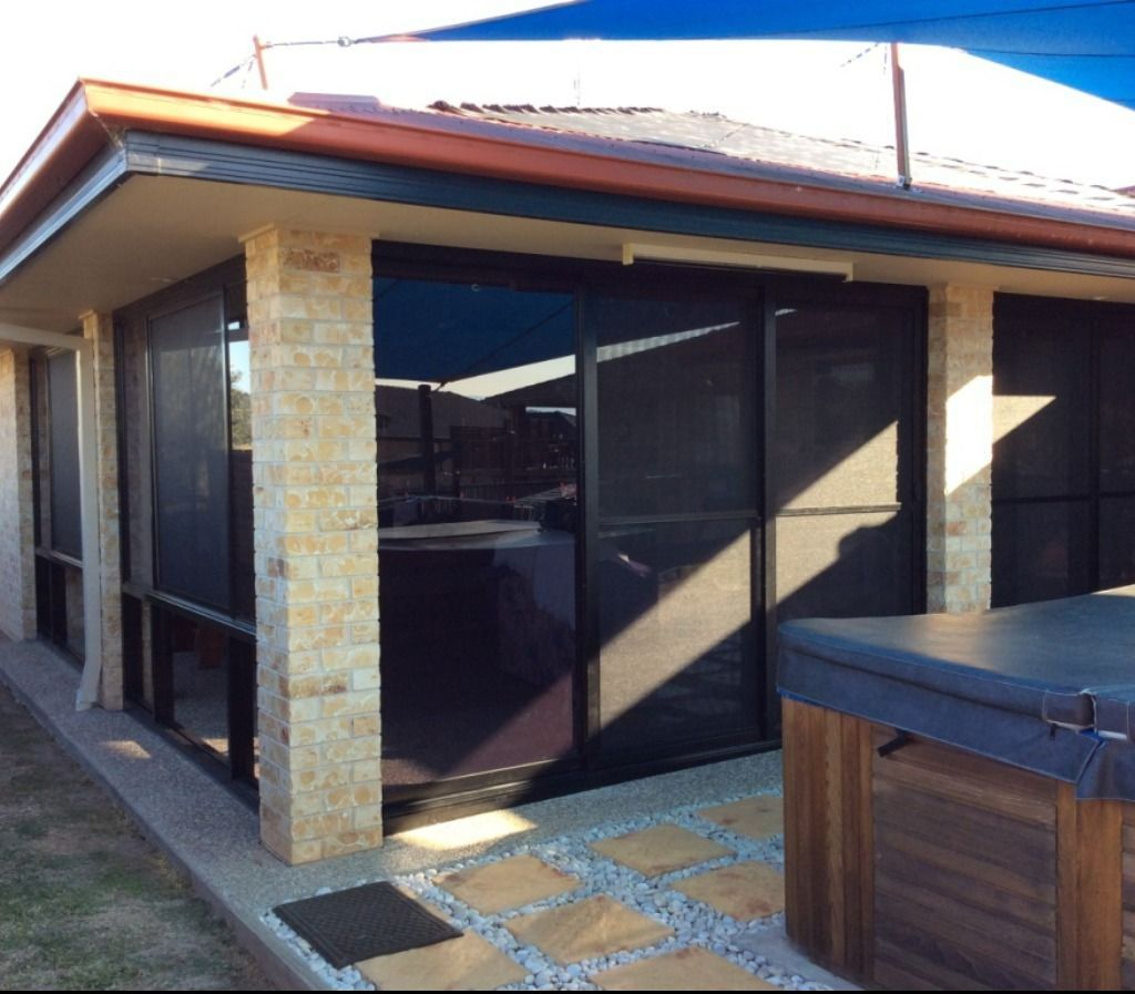 A House With A Hot Tub In Front Of It — Datco Aluminium Pty Ltd In Murwillumbah, NSW