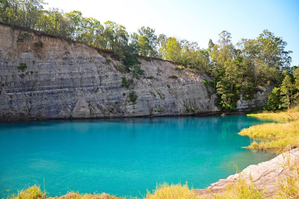 A Large Body Of Water Surrounded By Trees And Rocks — Datco Aluminium Pty Ltd In Lismore, City