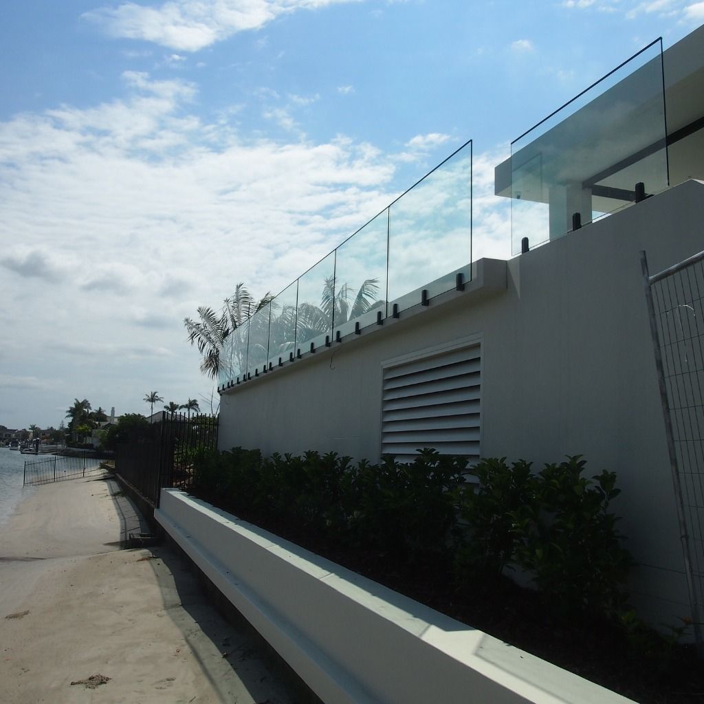 A White Building With A Glass Railing On Top Of It — Datco Aluminium Pty Ltd In Murwillumbah, NSW