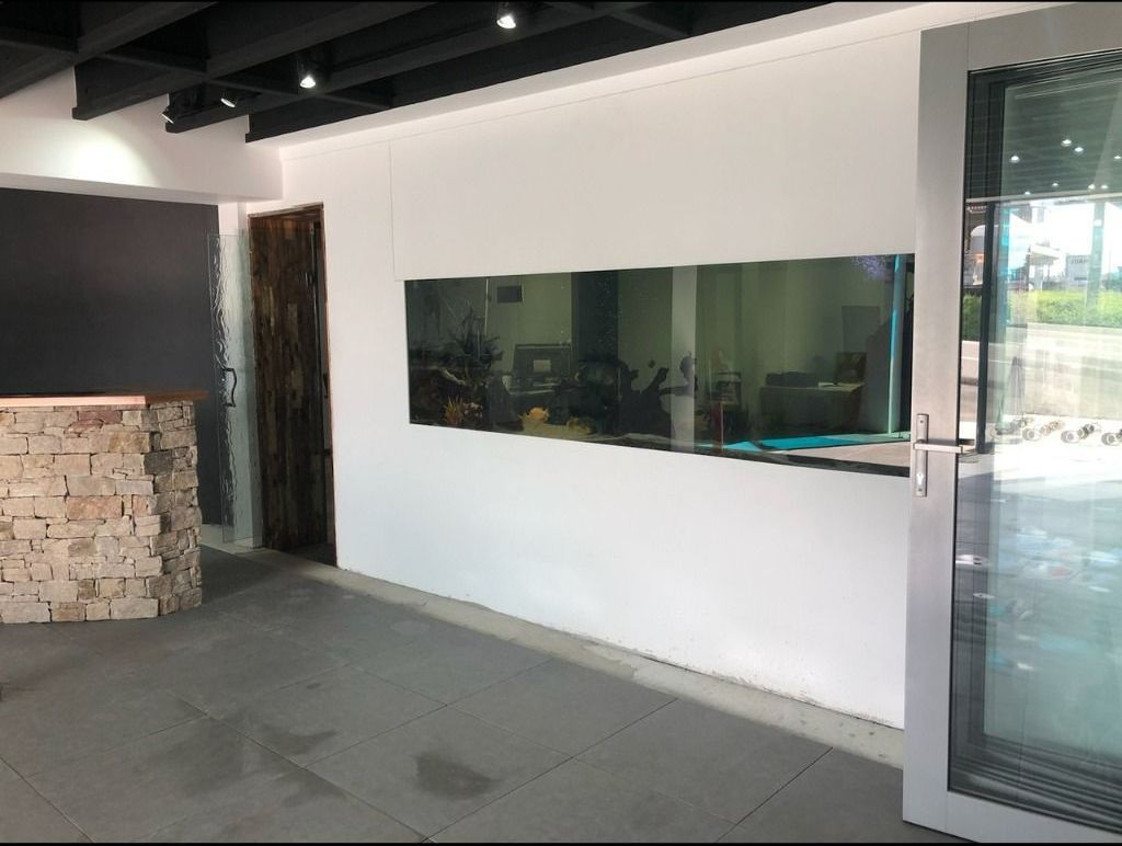 An Empty Room With A Large Window And A Door — Datco Aluminium Pty Ltd In Yamba, NSW