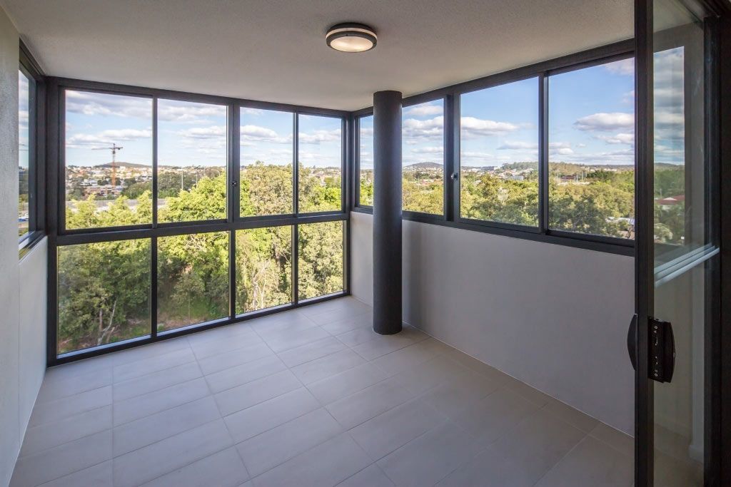 An Empty Room With A Lot Of Windows And A View Of Trees — Datco Aluminium Pty Ltd In Lismore, NSW
